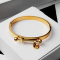 Brazalete_Themis_sobre_caja-blanca.jpg